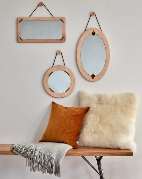 The latest designs of mirrors with geometric shapes decorate the walls of the modern home